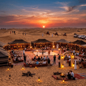 Desert camp with tourists watching traditional dancers, camels, and sunset in Dubai