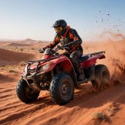 Rider on a quad bike in the Dubai desert wearing a helmet and safety gear