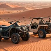 Quad bike and dune buggy side by side on Dubai red sand dunes